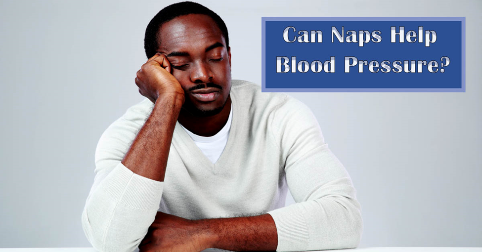 Naps and Blood Pressure. Picture of a black male sitting at a table with his head resting on one hand, napping.